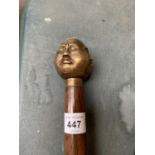 A FOUR FACED BUDDAH HANDLED WALKING STICK