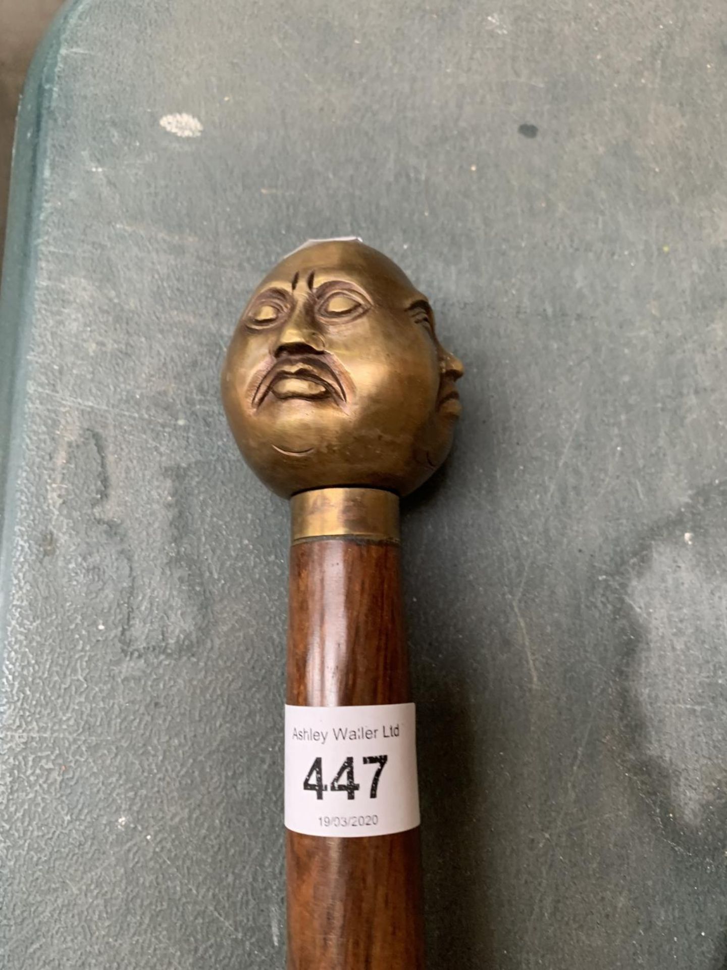 A FOUR FACED BUDDAH HANDLED WALKING STICK