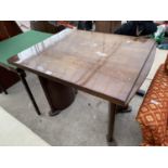 A MAHOGANY DRAW LEAF DINING TABLE