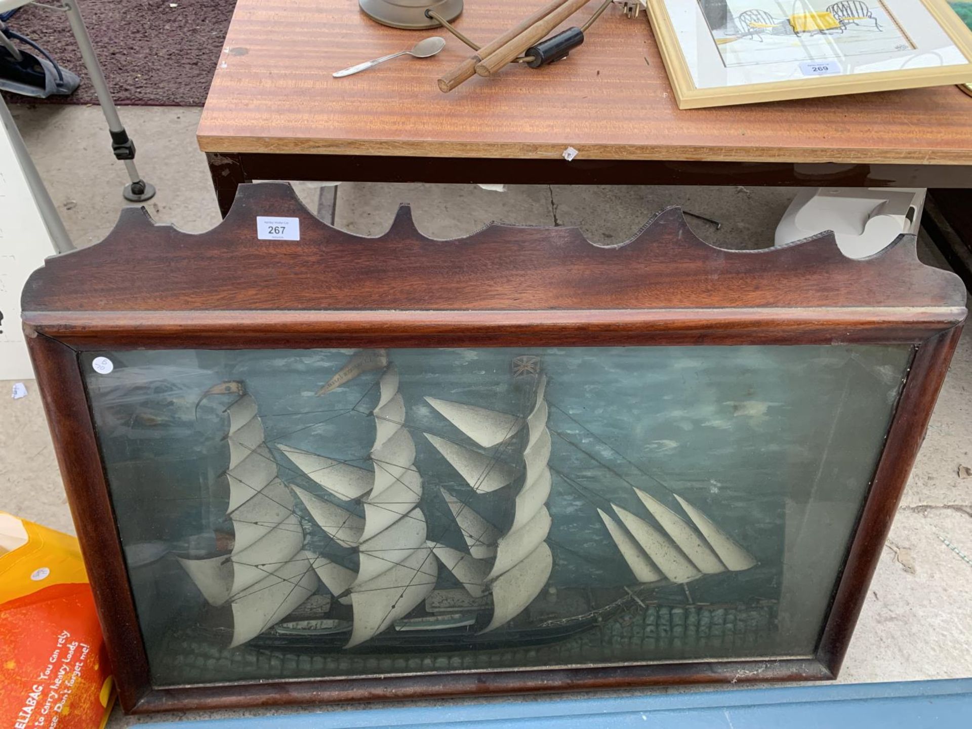 A GALLEON IN A WOODEN DISPLAY CASE