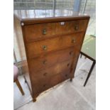 A WALNUT CHEST OF FIVE DRAWERS ON CABRIOLE SUPPORTS