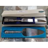 TWO CASED HALLMARKED SILVER HANDLED ITEMS - CAKE SLICE AND BREAD KNIFE