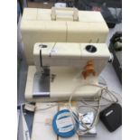 A CASED FRISTER ROSSMANN SEWING MACHINE WITH ACCESSORIES IN WORKING ORDER