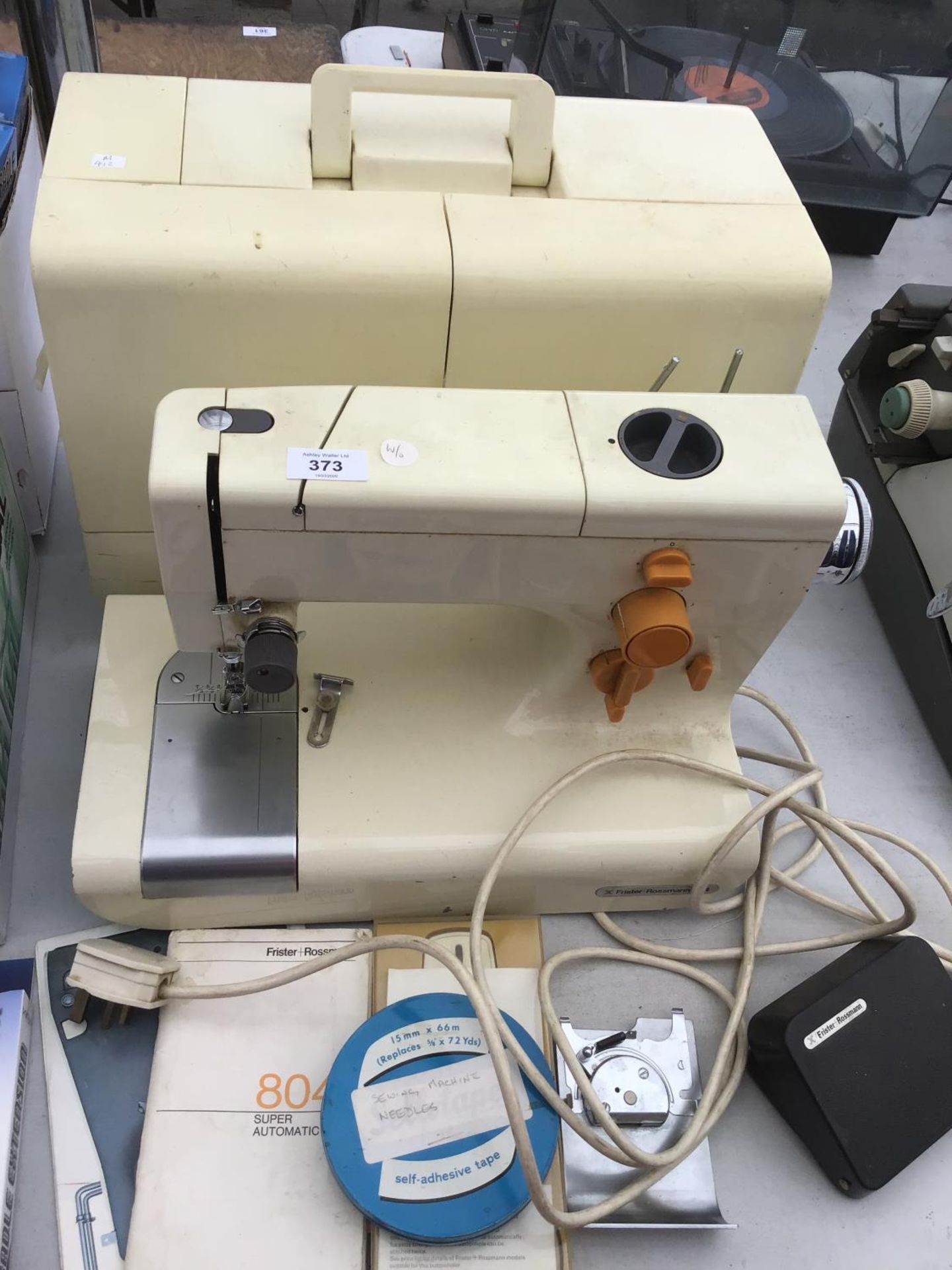 A CASED FRISTER ROSSMANN SEWING MACHINE WITH ACCESSORIES IN WORKING ORDER