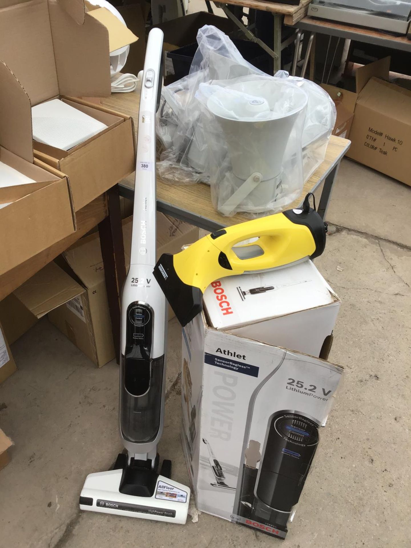 A BOSCH ATHLET VACUUM CLEANER AND A KARCHER HAND HELD IN WORKING ORDER