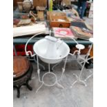 A VINTAGE ENAMEL WASH BOWL AND JUG ON METAL STAND