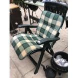 A GREEN PLASTIC GARDEN CHAIR WITH A CHECKED SEAT PAD