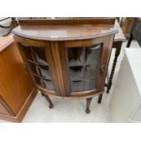 A SMALL MAHOGANY CABINET WITH TWO GLAZED PANEL DOORS