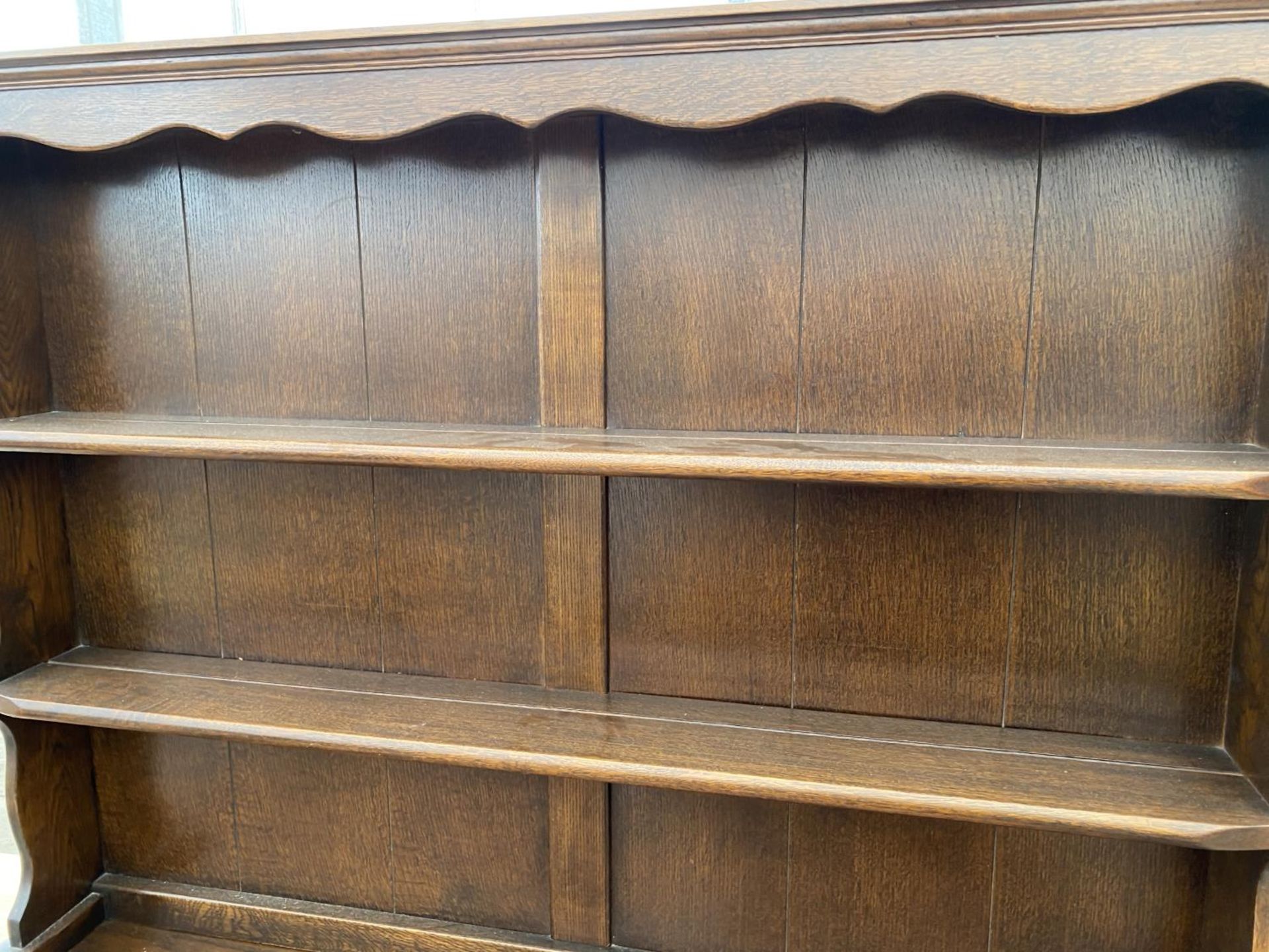 A PRIORY STYLE OAK DRESSER WITH TWO DOORS, TWO DRAWERS AND UPPER PLATE RACK - Image 2 of 4