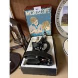 A VINTAGE BOXED STUDENTS MICROSCOPE