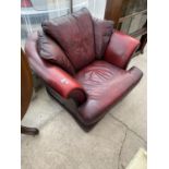 A RED LEATHER ARMCHAIR