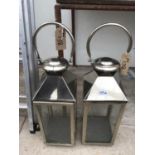 TWO LARGE MODERN CHROME AND GLASS LANTERNS