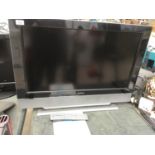 A HUMAX TELEVISION WITH REMOTE CONTROL, BOX AND INSTRUCTIONS IN WORKING ORDER 31 INCH