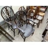 FOUR ELM SEATED WHEEL BACK DINING CHAIRS AND TWO CARVERS