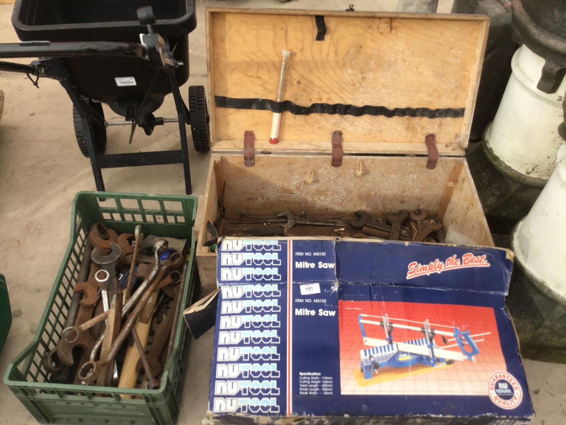 A WOODEN TOOL BOX WITH SPANNERS, A FURTHER BASKET WITH SPANNERS AND A BOXED MITRE SAW