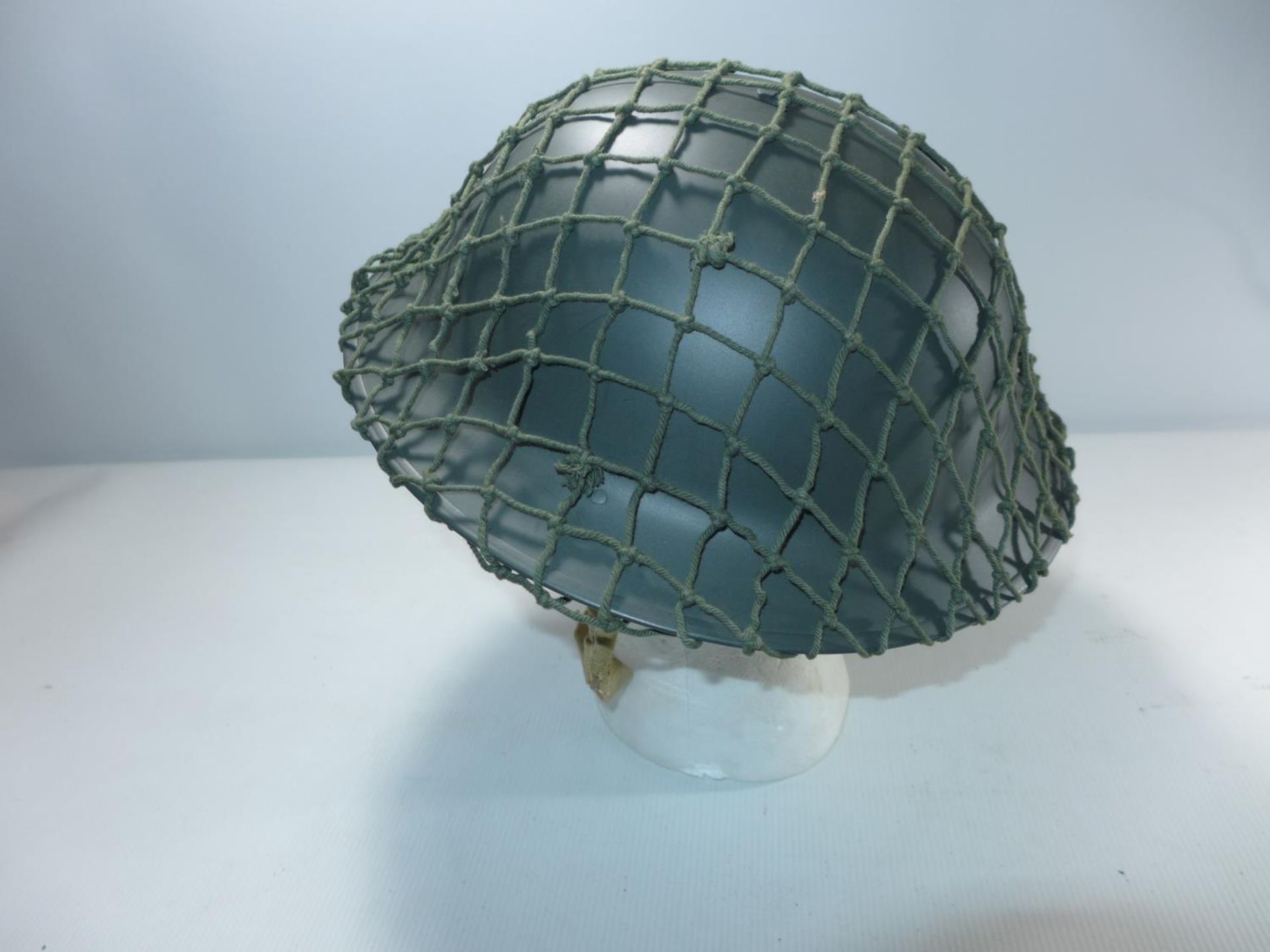 A BRITISH TOMMY HELMET AND NET COVER - Image 2 of 3