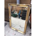 AN ORNATE GILT FRAMED MIRROR