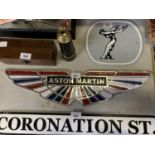 A CHROME AND PAINTED ASTON MARTIN SIGN