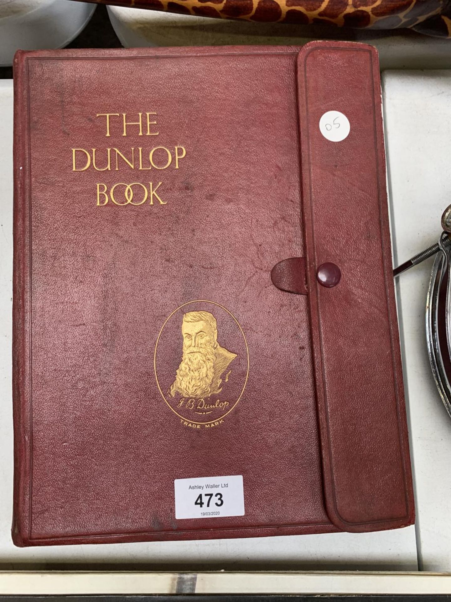 A 'THE DUNLOP BOOK' IN LEATHER EFFECT BINDING