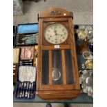 AN VINTAGE OAK CASED CHIMING WALL CLOCK