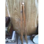 A VINTAGE PAIR OF WOODEN STILTS