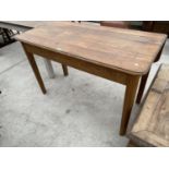 AN OAK DROP LEAF DINING TABLE