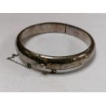 A HALLMARKED SILVER BANGLE