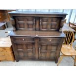 A PRIORY STYLE OAK COURT CUPBOARD WITH TWO LOWER DOORS AND DRAWERS AND TWO UPPER DOORS