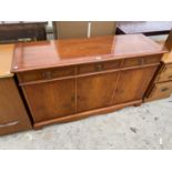 A YEW WOOD SIDEBOARD WITH THREE DOORS AND THREE DRAWERS