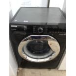 A BLACK HOOVER SILENT INVERTER WASHING MACHINE IN WORKING ORDER