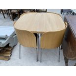 A RETRO DINING TABLE AND FOUR FITTED CHAIRS