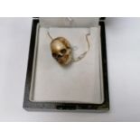 A BOXED SKULL PENDANT NECKLACE