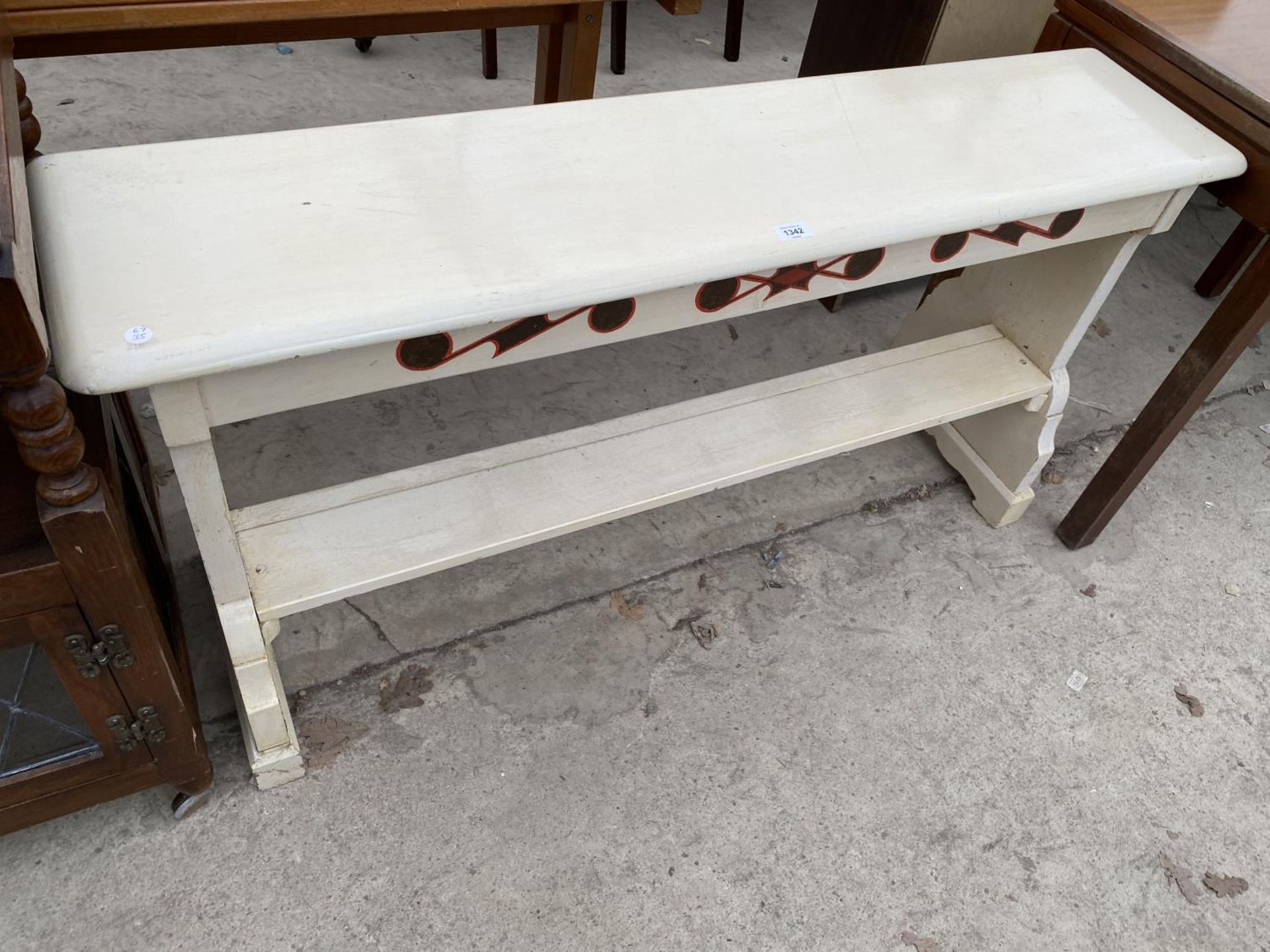 A WHITE PAINTED BENCH SEAT