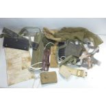 A BAG OF ASSORTED WEBBING, BELTS AND A BARREL PROTECTOR