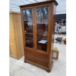 A WILLIS ABD GAMBIER CHERRY WOOD CABINET WITH TWO GLAZED DOORS AND TWO DRAWERS