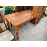 A RECTANGULAR PINE DINING TABLE