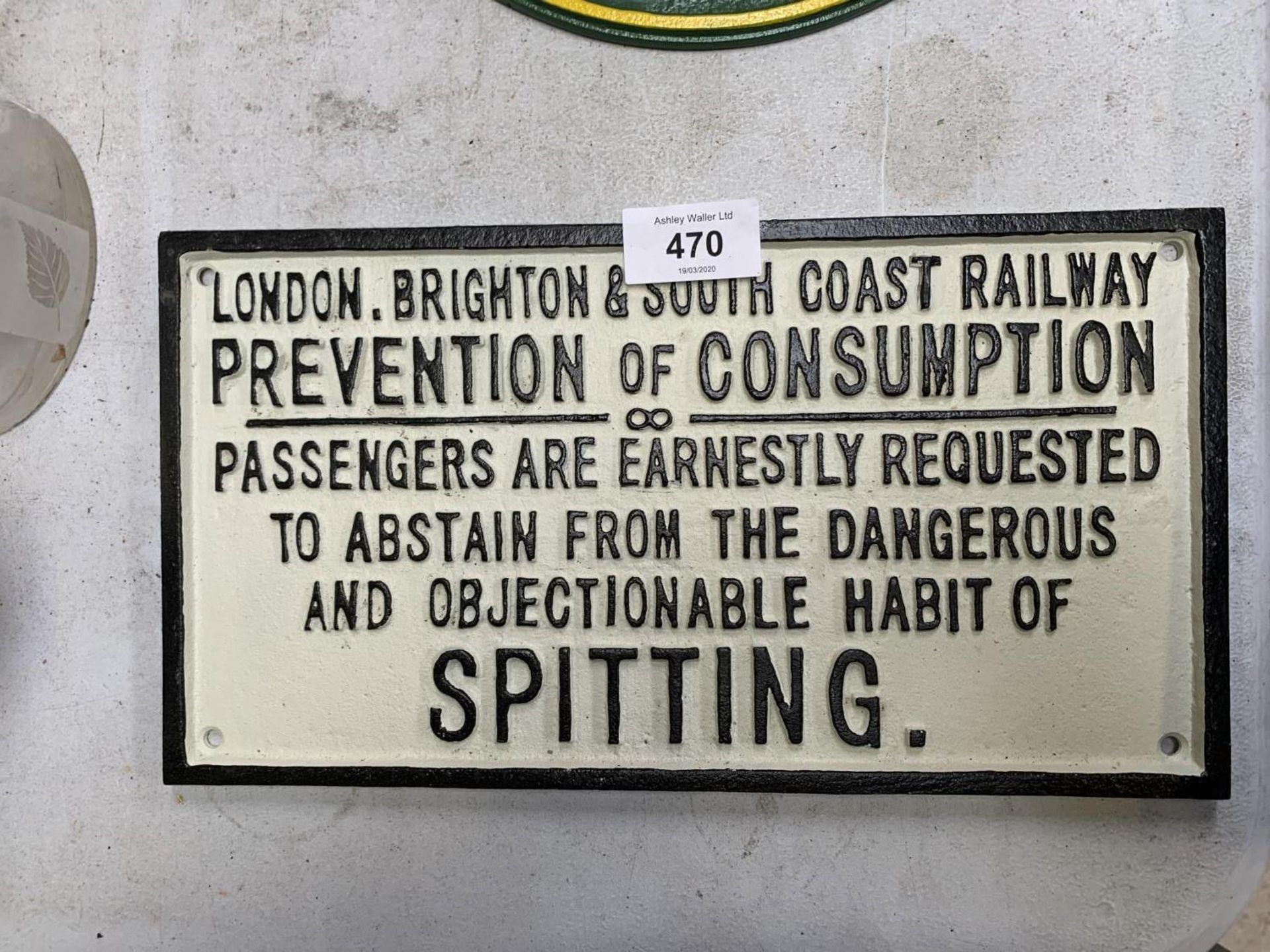 A CAST IRON 'PREVENTION OF CONSUMPTION' SIGN
