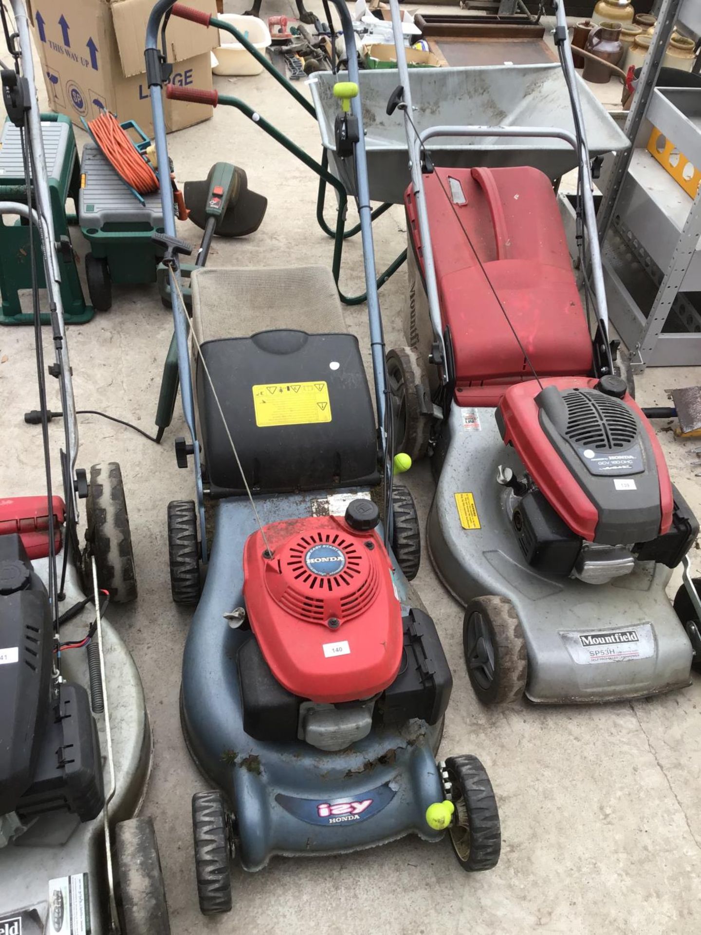 A HONDA IZY 18 INCH PETROL LAWNMOWER IN WORKING ORDER