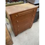 A TEAK CHEST OF FIVE DRAWERS