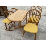 A CIRCULAR BEECH DROP LEAF DINING TABLE WITH PARQUET TOP AND FOUR PINE DINING CHAIRS