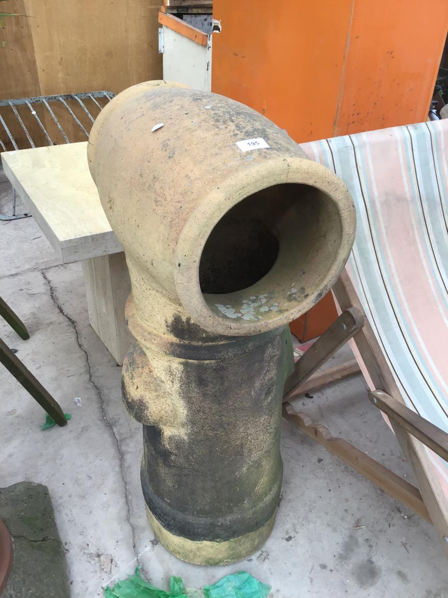 A LARGE YELLOW COLOURED CHIMNEY POT