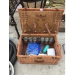 A SHIRE GREEN PICNIC BASKET WITH METAL CUPS. ORNATE WINE STOPPERS CAMPING PANS ETC