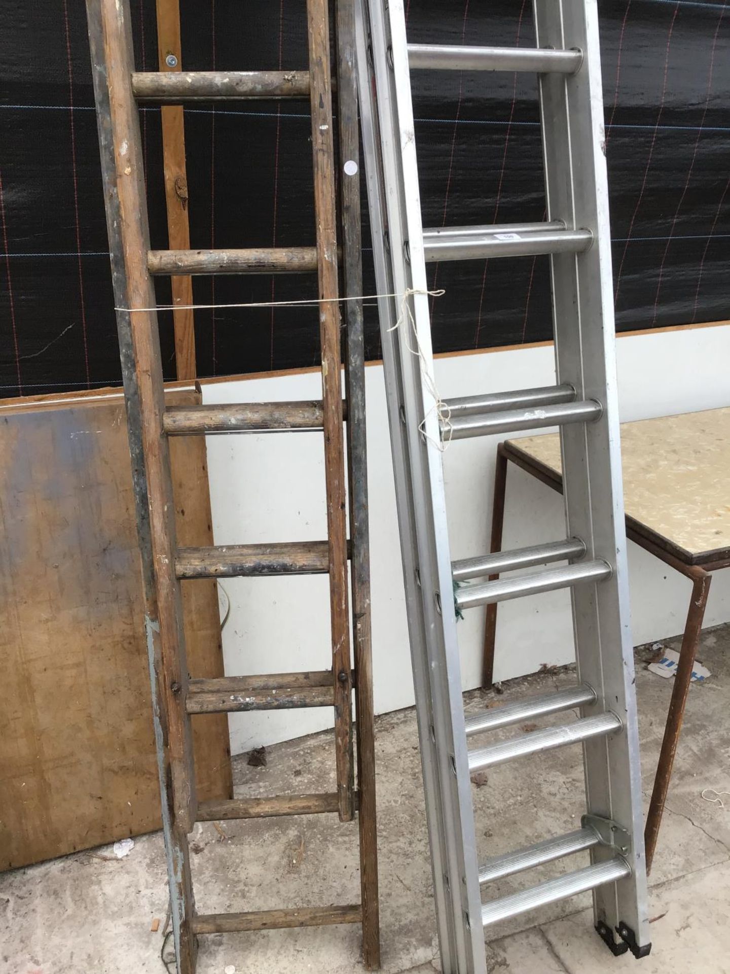 TWO EXTENDING LADDERS - ONE ALUMINIUM TWENTY FOUR RUNG TWO SECTION AND ONE WOODEN THIRTY RUNG TWO - Image 2 of 2