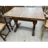 AN OAK DRAW LEAF DINING TABLE