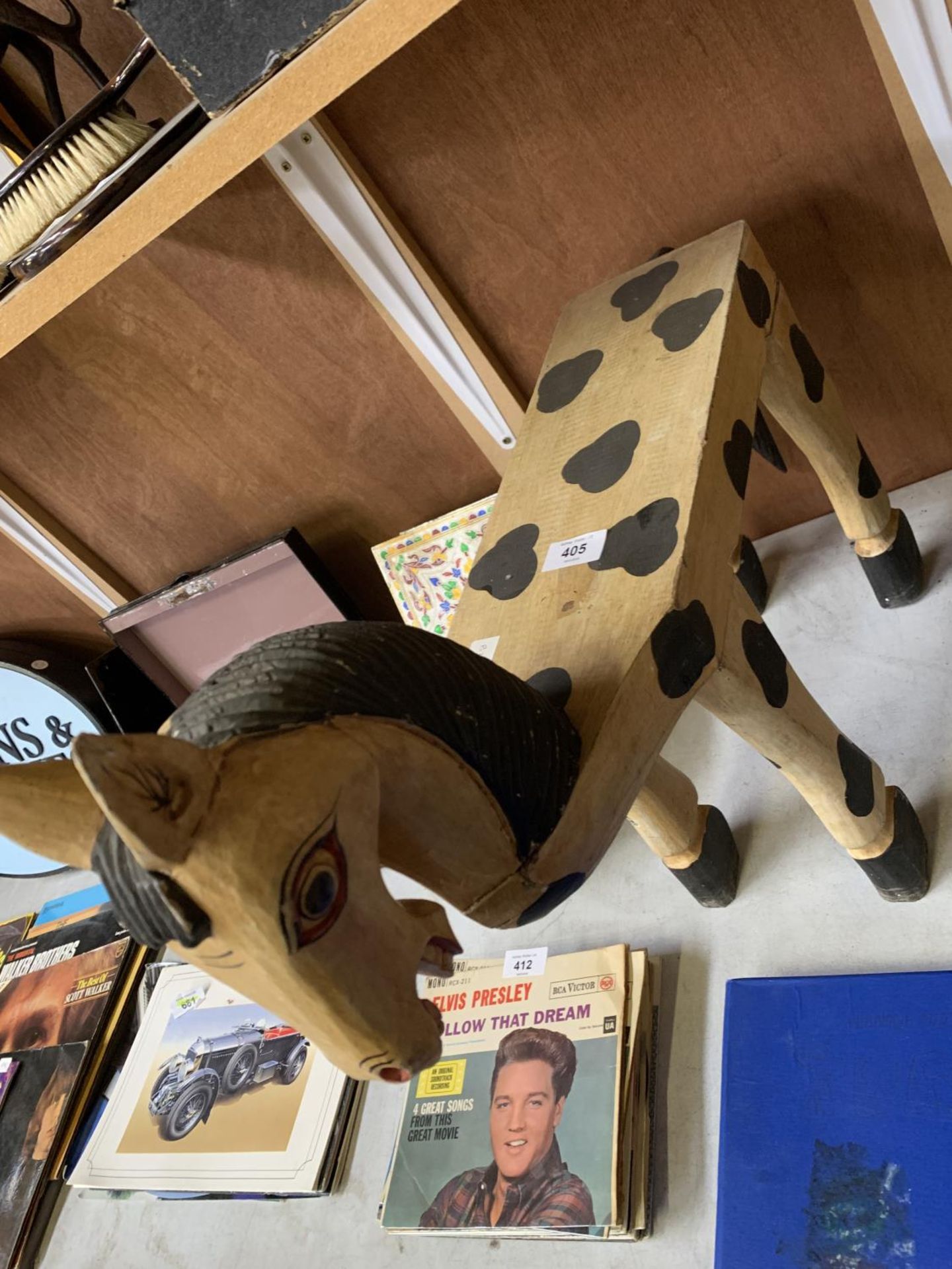 A DECORATIVE CHILDREN'S WOODEN HORSE SEAT