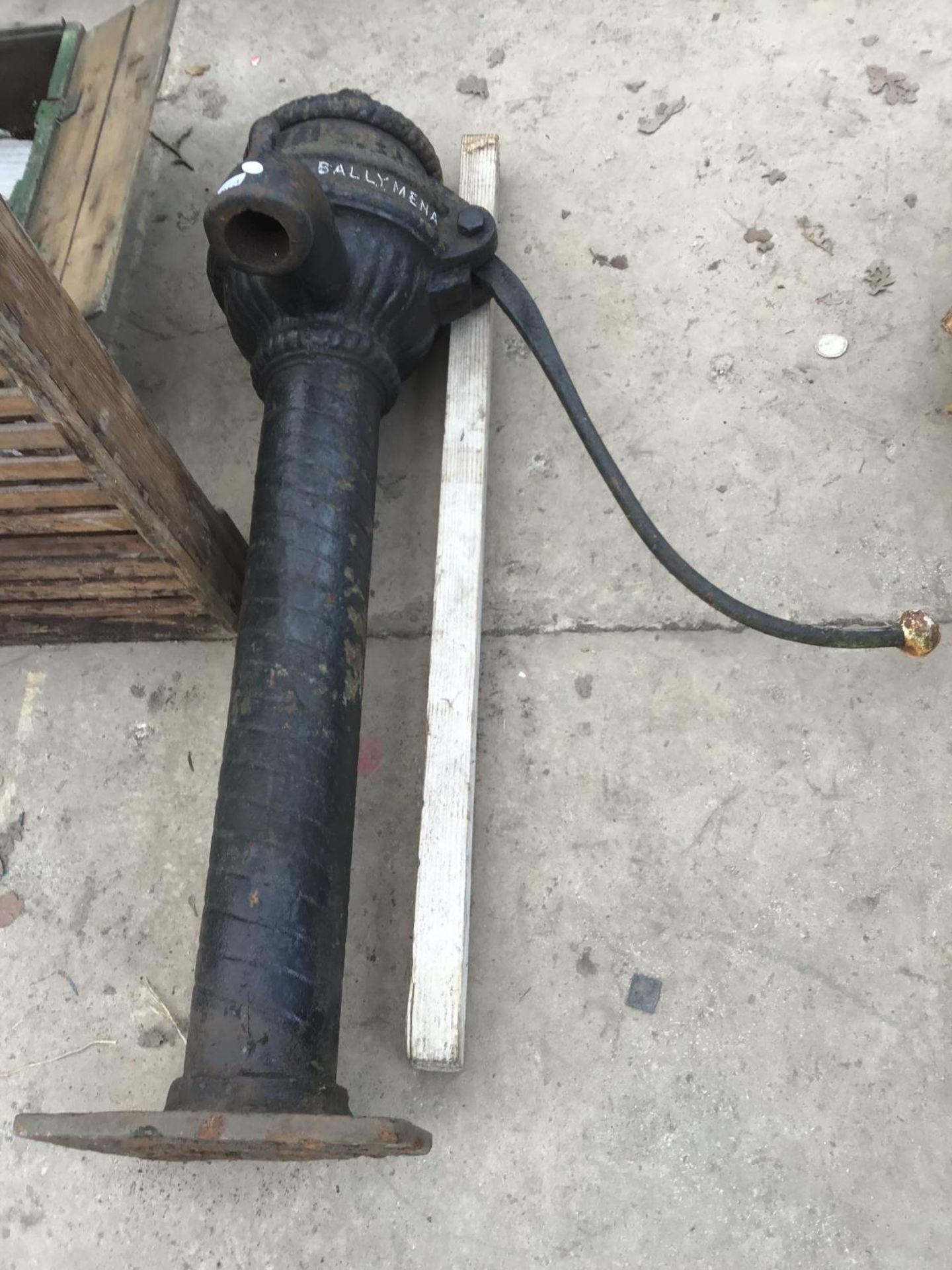 A CAST IRON TALL PUMP 'J McNIECE BALLYMENA' (A/F ON BASE)