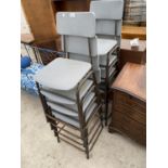 EIGHT RETRO STACKING CHAIRS