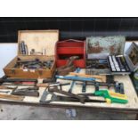 A LARGE COLLECTION OF TOOLS TO INCLUDE HAMMER, CHISEL, SAWS, WHEELBRACE, SOCKETS, WOODEN TOOL BOX