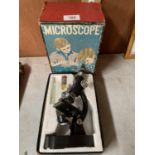 A VINTAGE BOXED STUDENTS MICROSCOPE