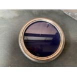 A ROUND SILVER PHOTO FRAME 10CM DIAMETER